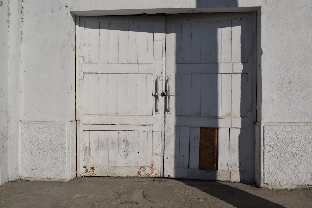 white wooden door closed during daytime