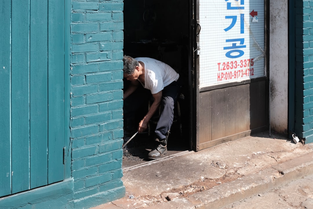 a man is opening a door to a building